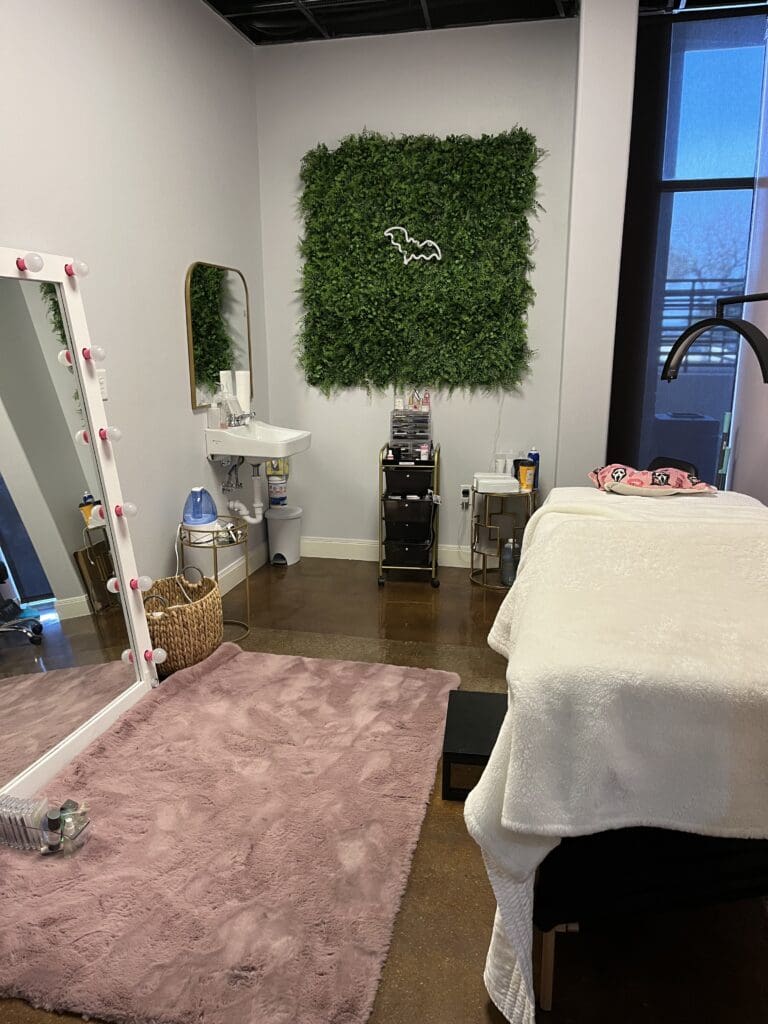 Beauty professionals collaborating on a salon marketing strategy aimed at clientele building, guided by a North Star vision for long-term growth.