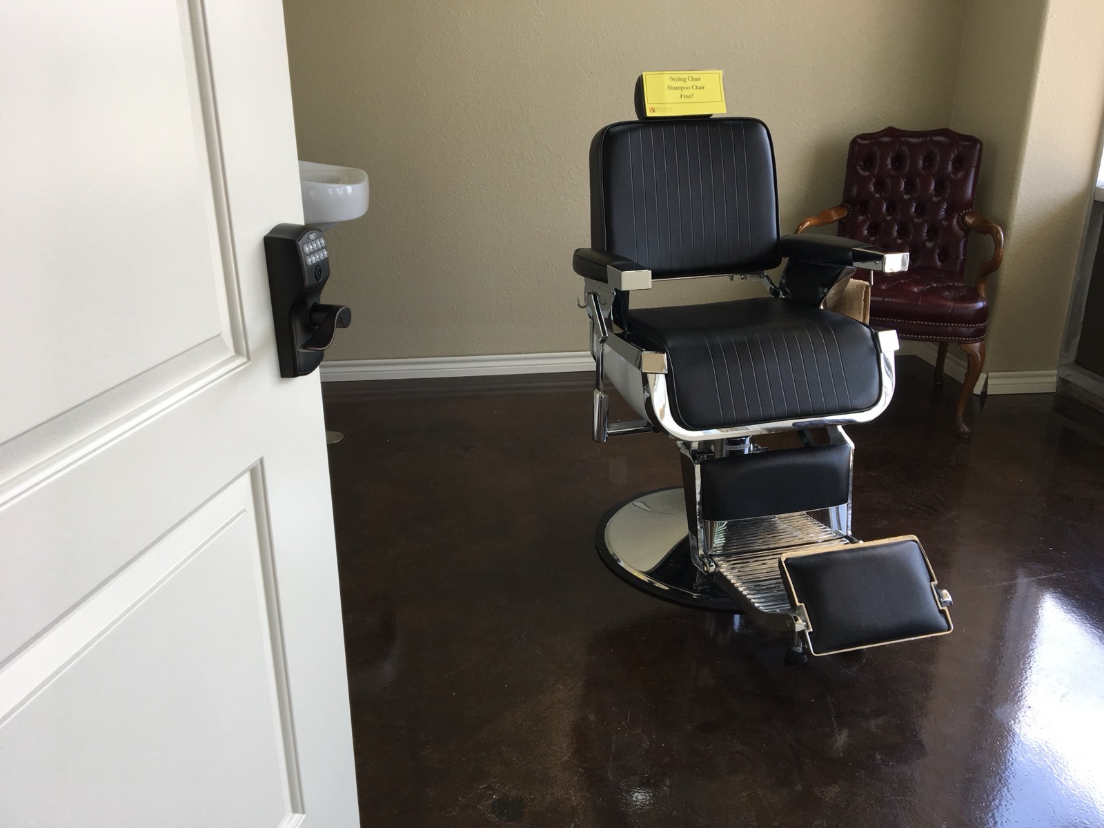 Private San Antonio salon suite with a barber styling chair and secure keypad entry door