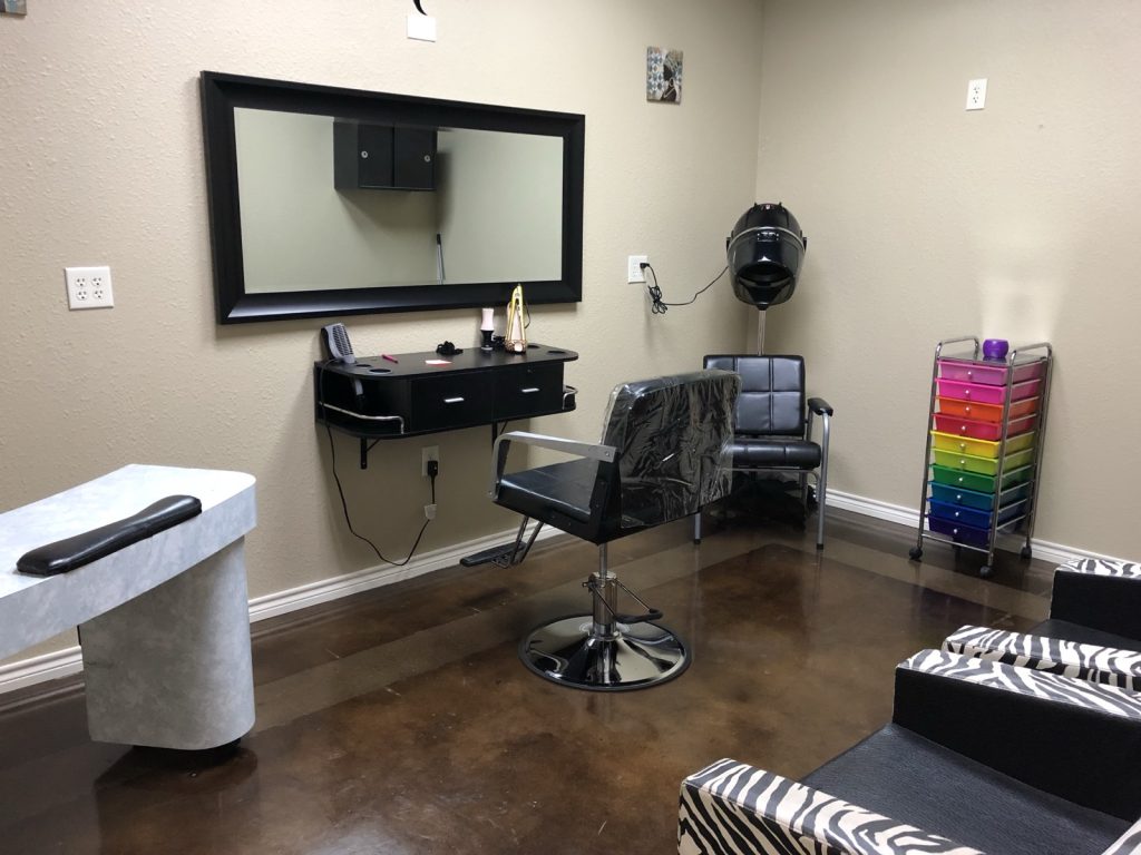 ove-in ready salon suite for rent in San Antonio with styling chair, mirror station, and hooded dryer