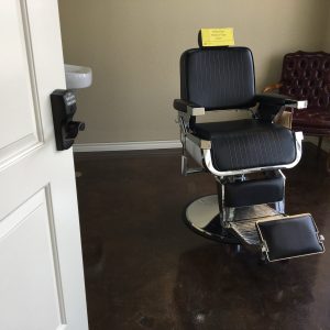 Private San Antonio salon suite with a barber styling chair and secure keypad entry door